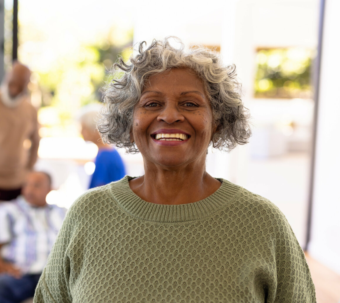 Portrait of smiling african american senior woman standing with